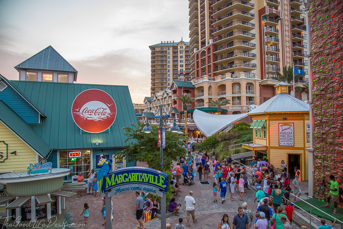 Crowded waterfront shopping village during a festival
