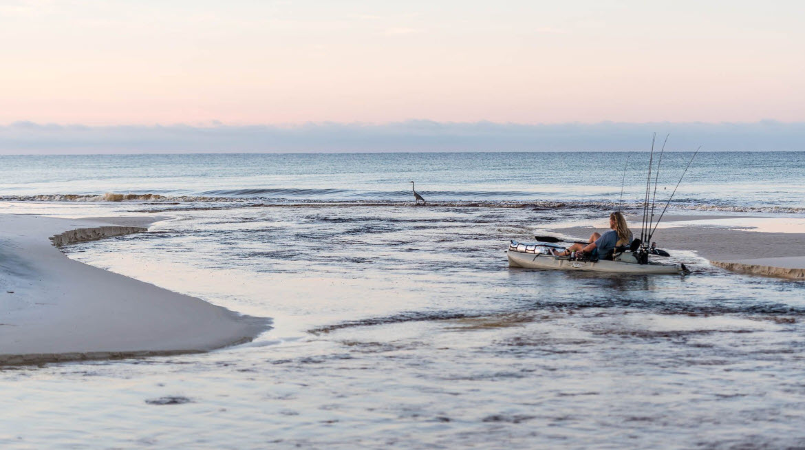 Personal watercraft riding through gentle Gulf waves